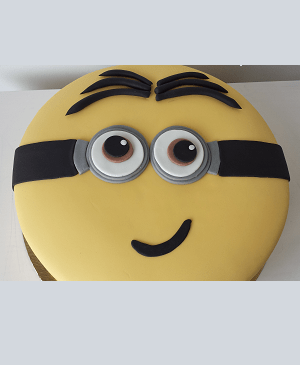 Een ronde minion verjaardagstaart